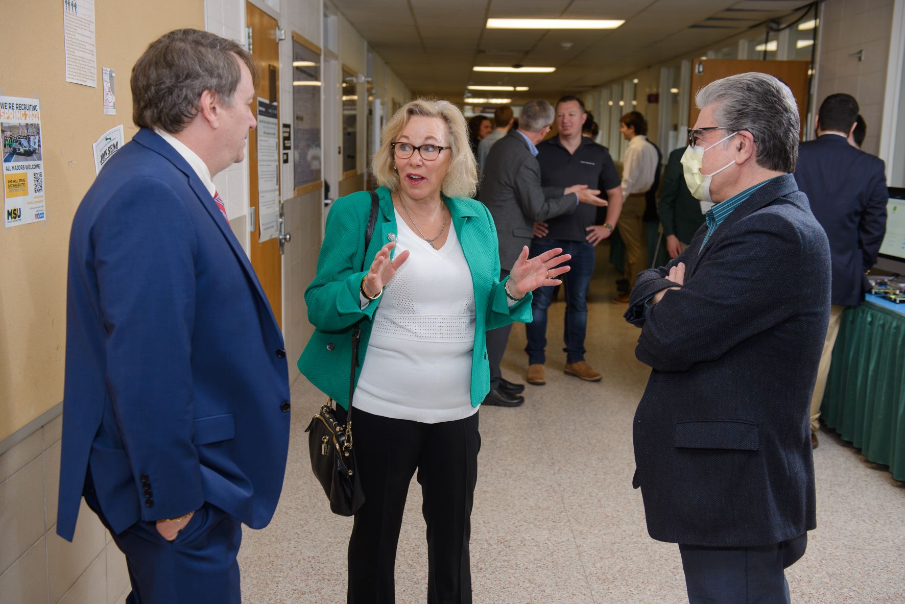 Melanie Foster, Dean Kempel and Abdol Esfahanian, Chair of CSE, talk about Design Day events