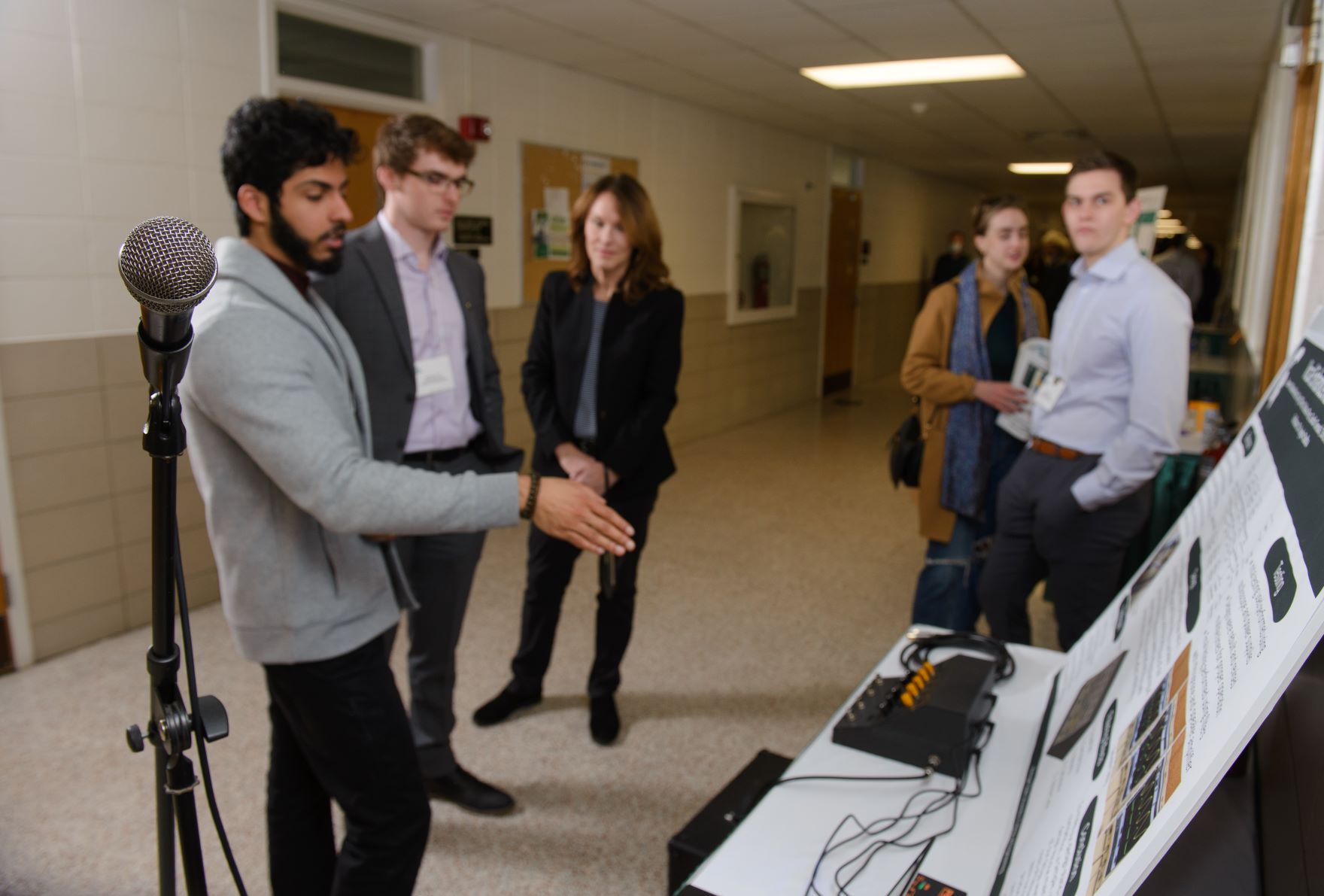 Electrical Engineering students show off their voice enhancement device