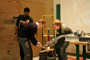 Mechanical Design II students add weight to their deployable bridge