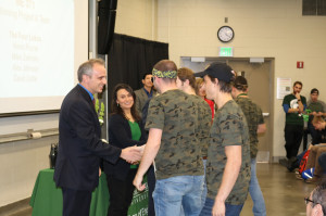 The winning Mechanical Design I team is congratulated by Michael Lavagnino