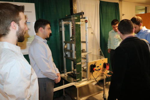 The Mechanical Engineering Fraunhofer team discusses their project with visitors
