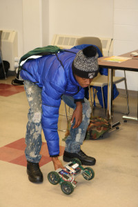 A high school visitor prepares to test his VEX Robotics Vehicle    