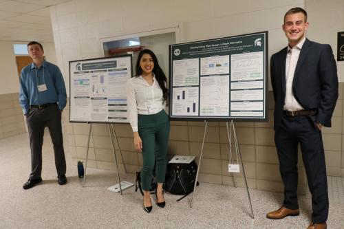 Chemical Engineering students wait to discuss their poster projects with attendees