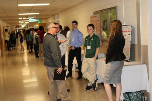 Freshmen Engineering students discuss their projects with visitors